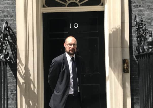 Richard Askew is pictured outside Number 10 Downing Street.