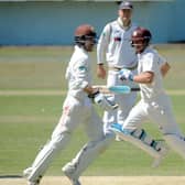 Rory Burns and Scott Borthwick on their way to a second-wicket stand of 47 that helped County Championship Division One leaders Surrey secure a seven-wicket victory over Yorkshire at Scarborough (Picture: Dave Williams).