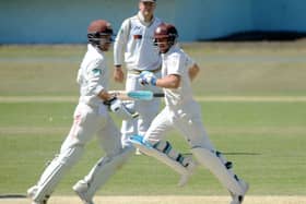 Rory Burns and Scott Borthwick on their way to a second-wicket stand of 47 that helped County Championship Division One leaders Surrey secure a seven-wicket victory over Yorkshire at Scarborough (Picture: Dave Williams).