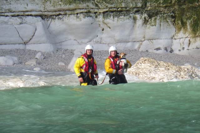 Lifeboat crew rescue the dog from a cave