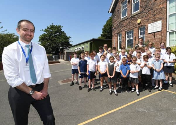 Headteacher Luke Fletcher with pupils at Boynton Primary School. Picture by Paul Atkinson