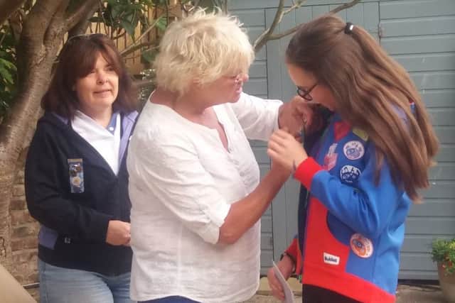 Trish Kinsella presents the Baden-Powell award to Alexandra Armitage.