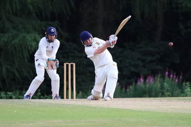 Flixton skipper Will Norman hits out on his way to 51 at Falkland. Picture by David Potter.