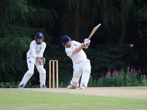 Flixton skipper Will Norman hits out on his way to 51 at Falkland. Picture by David Potter.