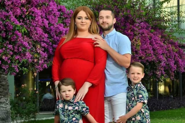 Emily, her partner Ross, and their boys Oscar and Oliver.