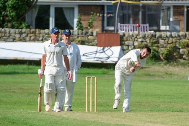 Sherburn's Ben Briggs turns his arm over at Cloughton. Picture by Andy Standing.