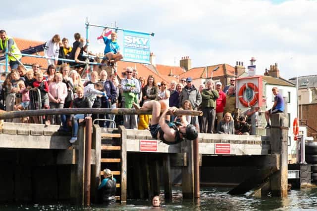 The greasy pole competition at Whitby Regatta 2017. Picture by Ceri Oakes w173002a