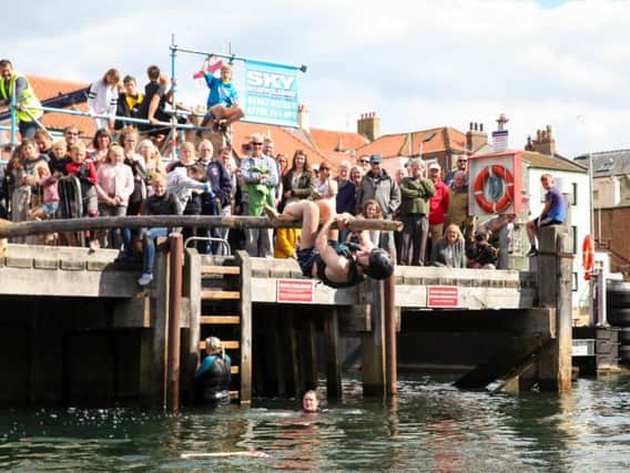 The greasy pole competition at Whitby Regatta 2017. Picture by Ceri Oakes w173002a