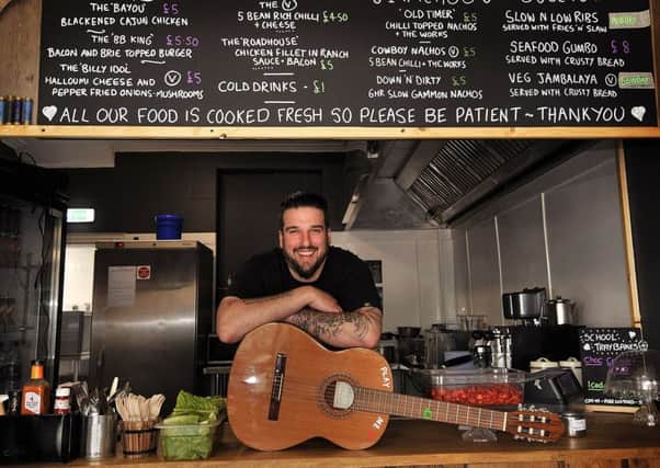 Tommy Taylor prepares for guests in his bar and restaurant in Filey