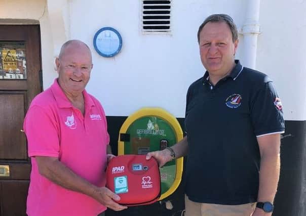 Roger Buxton, commodore, (left) and Edd Peacock, vice-commodore, with the new life-saving equipment.