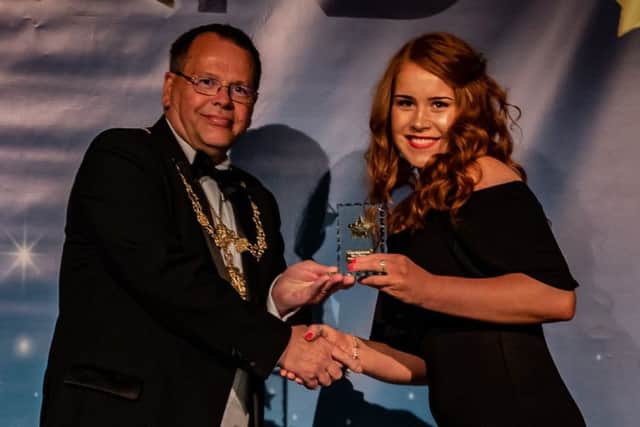 Apprentice of the Year Mollie French is presented with her award.