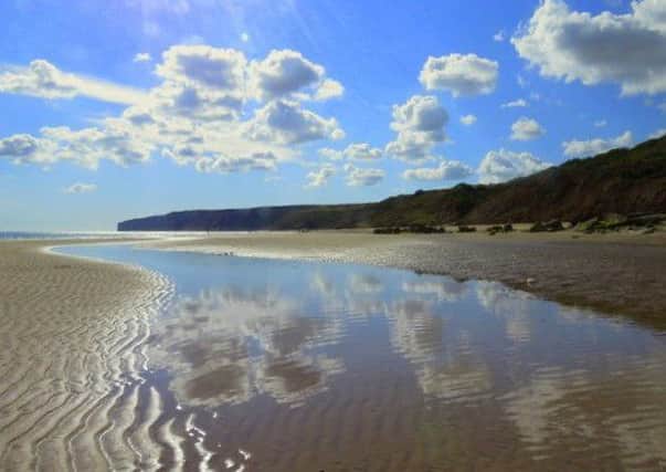 Julia West captured this excellent image of Reighton Sands, complete with a superb reflection of the clouds.