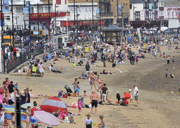 People flock to Scarboroughs South Beach this summer.