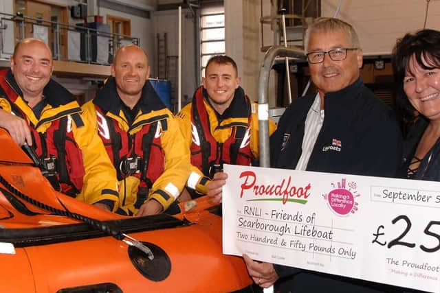 From left: crew members Mark Jenkinson and Lee Holmes, coxswain Lee Marton, lifeboat operation manager Andrew Volans and Proudfoots director Valerie Aston.