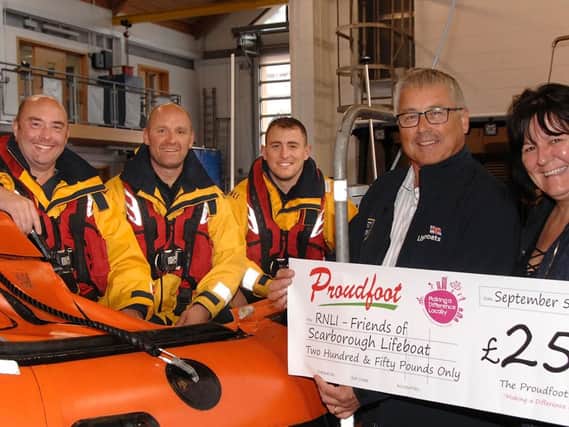 From left: crew members Mark Jenkinson and Lee Holmes, coxswain Lee Marton, lifeboat operation manager Andrew Volans and Proudfoots director Valerie Aston.