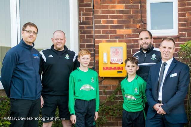 From left: Fishburn Park U13 treasurer Luke Walker, c.ub treasurer Mark Burnett, U13 players Josh Walker and Tom Layton, U13 manager Rob Layton and Paul Dixon, Deputy Head of Eskdale School.