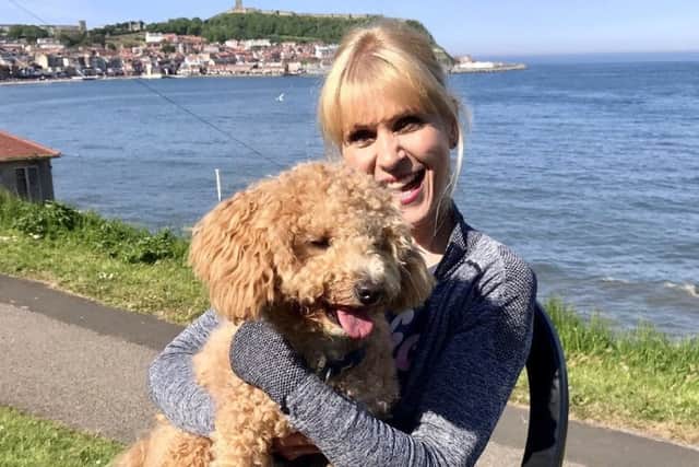 Carolyn Hodgson and her dog Winston.