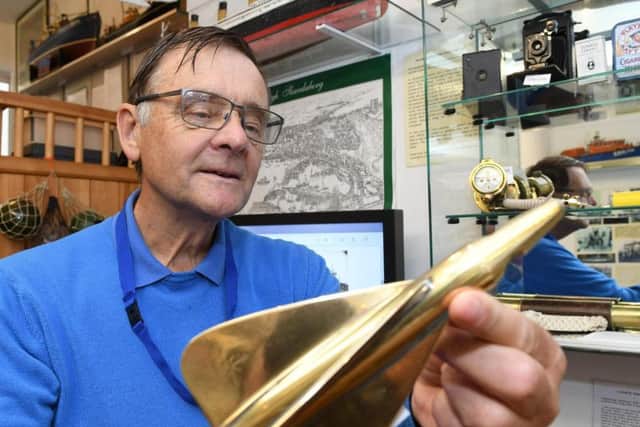 Scarborough Maritime Heritage Centre volunteer John Ives pictured with some of the items on display