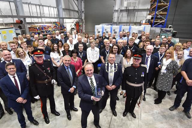 Dale Power Solutions CEO Tim Wilkins with staff and distinguished guests at the presentation.
