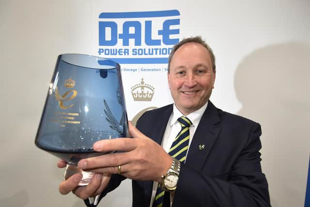 Tim Wilkins with the Queens Award for promoting opportunity.