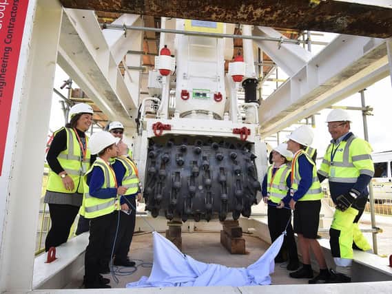 Children from Sleights Primary School unveil the new vertical shaft sinking machine at the Woodsmith Mine Site