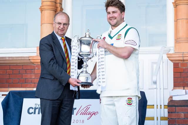 Flixton skipper Will Norman receives the trophy. Picture by Will Palmer.