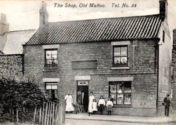 The Wood family stand proudly outside their shop in Old Malton.