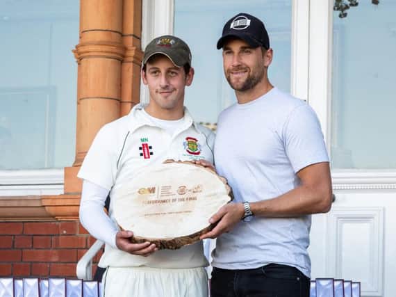 Middlesex and Englands Dawid Malan hands over an award to Matt Nesfield. Picture by Will Palmer.
