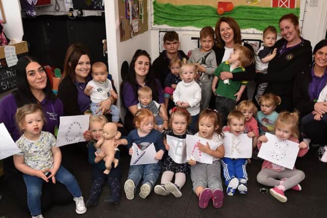 Staff and children celebrate at Happy Days Nursery