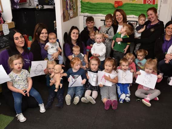 Staff and children celebrate at Happy Days Nursery
