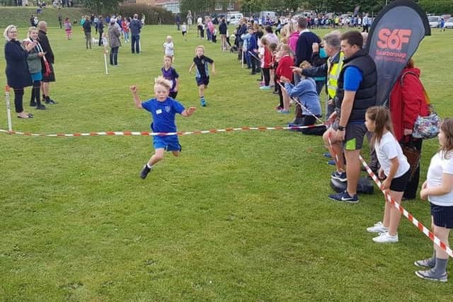 William Chapman wins the Year 3 Boys race.