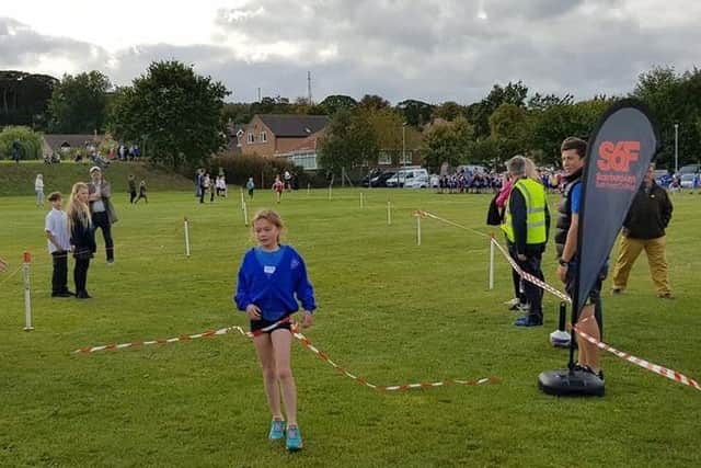 Rebecca Dove wins the Year 4 Girls race.