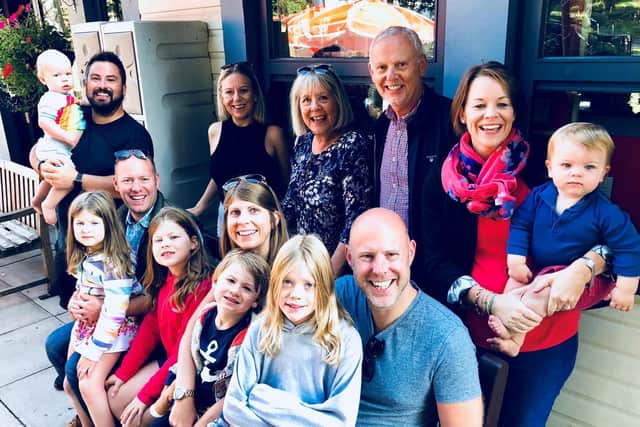 Andrew with his wife Vicki Redpath (at the back) and extended family including children and grandchildren.
