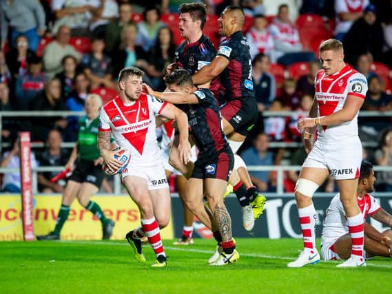 Wigan's John Bateman, middle, celebrates his try against St Helens. (SWPix)