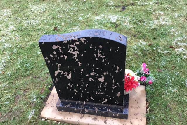A gravestone which was vandalised during the drive