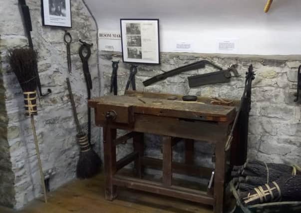 The display of besoms and the equipment used to make them at Beck Isle Museum, Pickering.