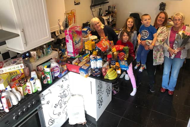 Wendy Sellars, left, and Cheryl Harris of Proudfoots with grandma Hazel Wooldridge, right, and some of Damians children.