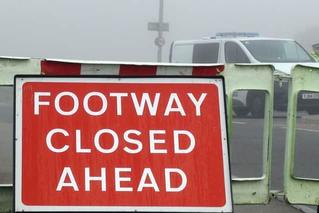 Police at the closed A6201 road between Upton and Hemsworth, West Yorkshire, where four people died when a quad bike collided with a sports car on Sunday morning.