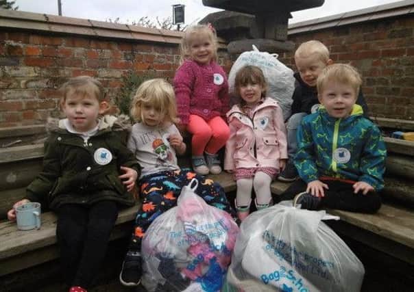 Rillington pre-school pupils with some of the Bags 2 School collection.