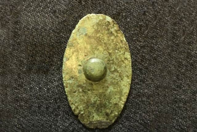 The miniature Iron Age bronze shield from Malton Museum.
