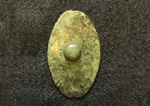 The miniature Iron Age bronze shield from Malton Museum.