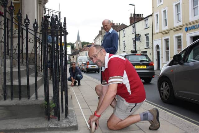 Volunteers measure building frontages and alleyways in Malton.