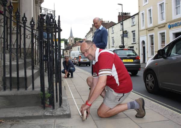Volunteers measure building frontages and alleyways in Malton.