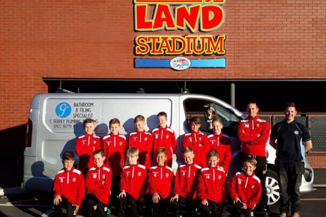 Scarborough Athletic Under-11s show off their new tracksuits, which have been bought by Chris Ferrey, back right, of Chris Ferrey Plumbing & Heating