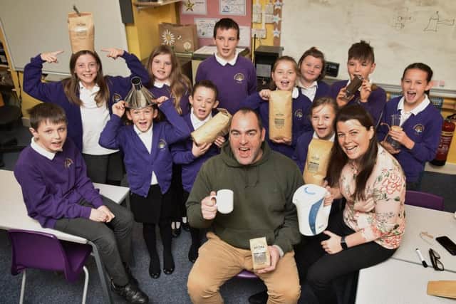 Hawsker Primary school children learn about coffee with visitor Nick Hartley of Baytown Coffee..also pictured is teacher Katrina Dixon. pic Richard Ponter
