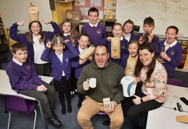 Hawsker Primary school children learn about coffee with visitor Nick Hartley of Baytown Coffee..also pictured is teacher Katrina Dixon. pic Richard Ponter