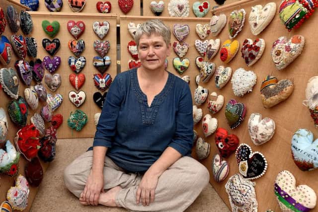 Helen Birmingham takes a break from her sawdust hearts project . Richard Ponter