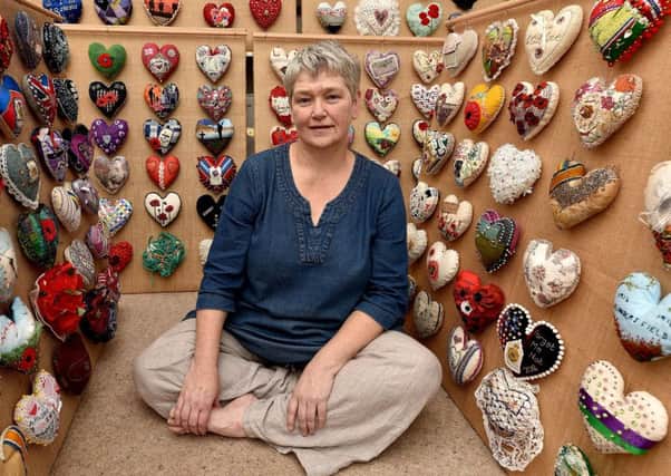 Helen Birmingham takes a break from her sawdust hearts project . Richard Ponter