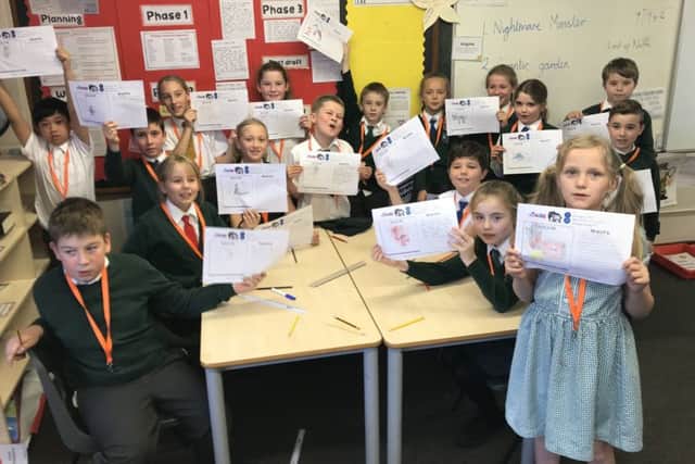 Malton Community Primary School Year 5 pupils with their designs.