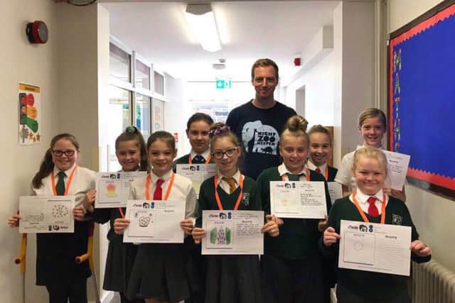 Year Six pupils are pictured with Paul Hutson from Night Zookeeper.